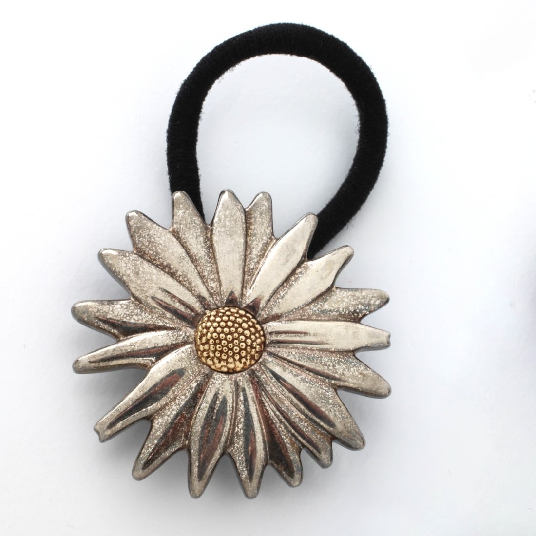 Tiffany & Co Daisy Hair Band: Vintage Tiffany & Co Sterling Silver and 18 Karat Yellow Gold Daisy Pony Tail Hair Band. Signed, stamped 925 750. Daisy measures 1-7/8" diam. Approx. gross weight: 29.01 grams. With Tiffany suede stor