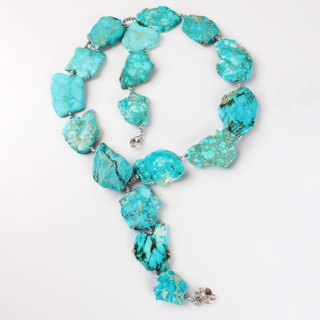 Turquoise Necklace: Chunky Turquoise Stone Slab Two Strand Necklace with Beads and Sterling 925 Silver Clasp. Measures: 17" long. Kodner Galleries offers phone and absentee bidding at a low, flat 21% buyer?s premium