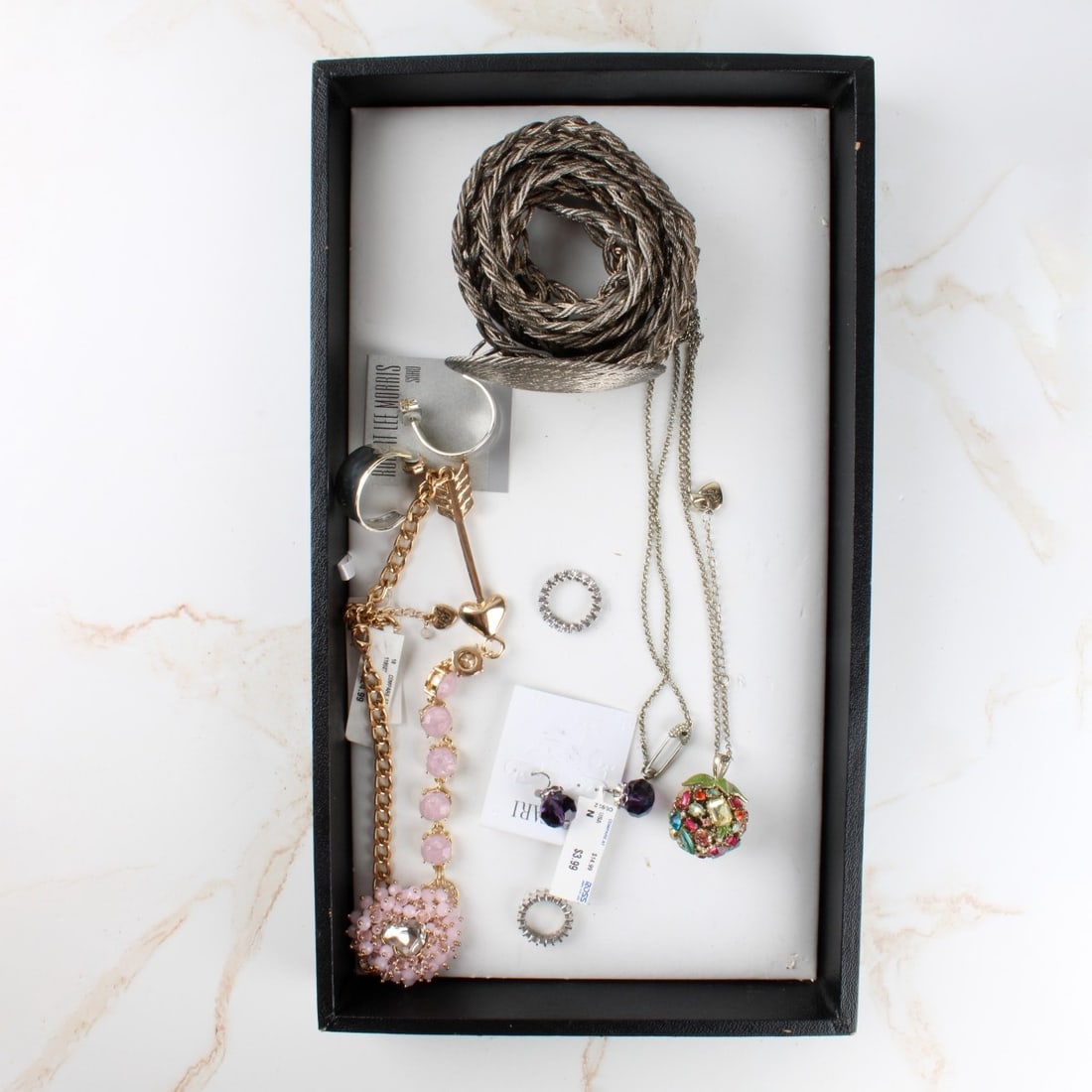 Vintage Costume Jewelry: Tray Lot of Vintage Costume Jewelry. Including a belt, earrings, brooches, necklaces. Variously accented with faux color stones, faux diamonds, faux pearls and more. Various styles and makers. Kodner