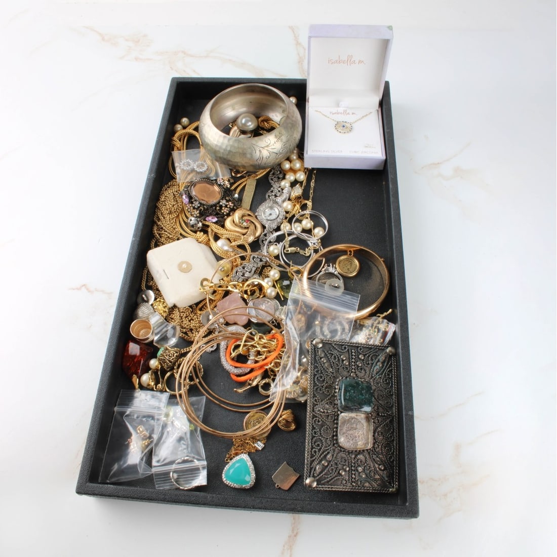 Tray Lot of Vintage Costume Jewelry: Tray Lot of Vintage Costume Jewelry. Including earrings, brooches,pins, bracelets, necklaces, rings,and a watch. Variously accented with faux color stones, faux diamonds, faux pearls and more.