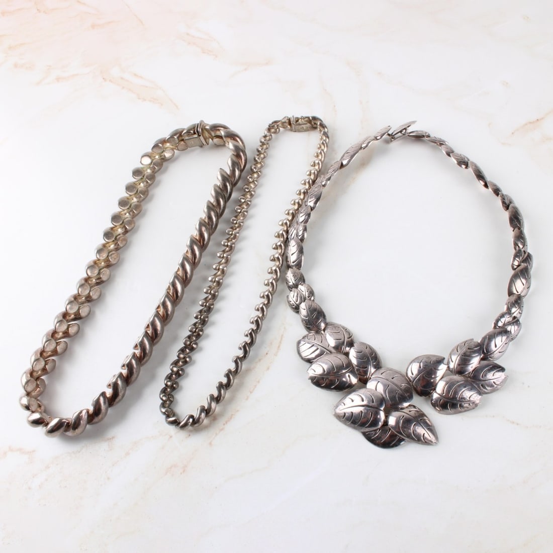 Sterling Silver Necklaces: Three (3) Vintage Sterling Silver Necklaces. Two (2) stamped "ITALY 925" longest 16-1/2, choker measures: 13-1/2" shorter chain measures:15-1/2" long. Total weight: 227 grams. Kodner Galleries offers
