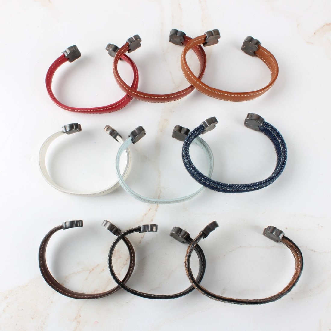 Leather and Silver Cuff Bracelets: Leather and Silver Cuff Bracelets. Kodner Galleries offers phone and absentee bidding at a low, flat 21% buyer?s premium without surcharge or hidden fees. For information, please contact the gallery