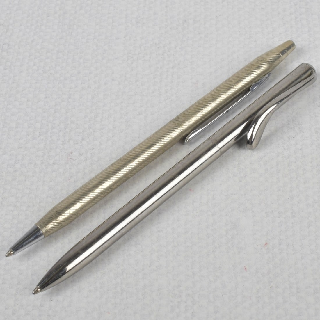 Vintage Tiffany & Co Pens: Two (2) Vintage Tiffany & Co Sterling Silver Writing Pens. Both properly stamped and one (1) stamped Peretti. Kodner Galleries offers phone and absentee bidding at a low, flat 21% buyer?s premium