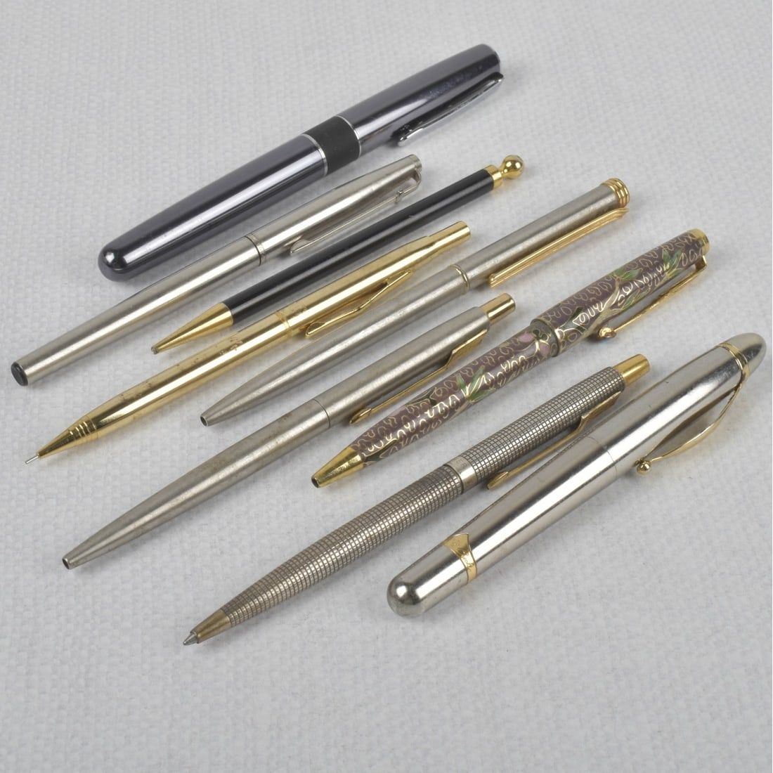 Writing Instruments: Lot of Nine (9) Writing Instruments. Including Parker, Creeks & Creeks. Kodner Galleries offers phone and absentee bidding at a low, flat 21% buyer?s premium without surcharge or hidden fees. For info