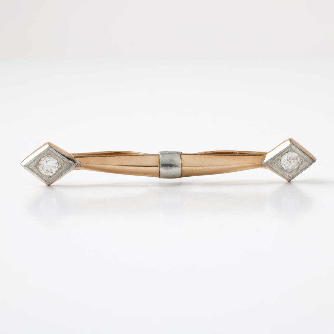 Diamond and 14K Collar Bar: Vintage Approx. .25 Carat TW Two Round Cut Diamond and 14 Karat Yellow and White Gold Collar Bar. Diamonds G-H color, SI clarity. Measures 2-3/4" L. Approx. weight: 5.35 grams. Kodner Galleries offers