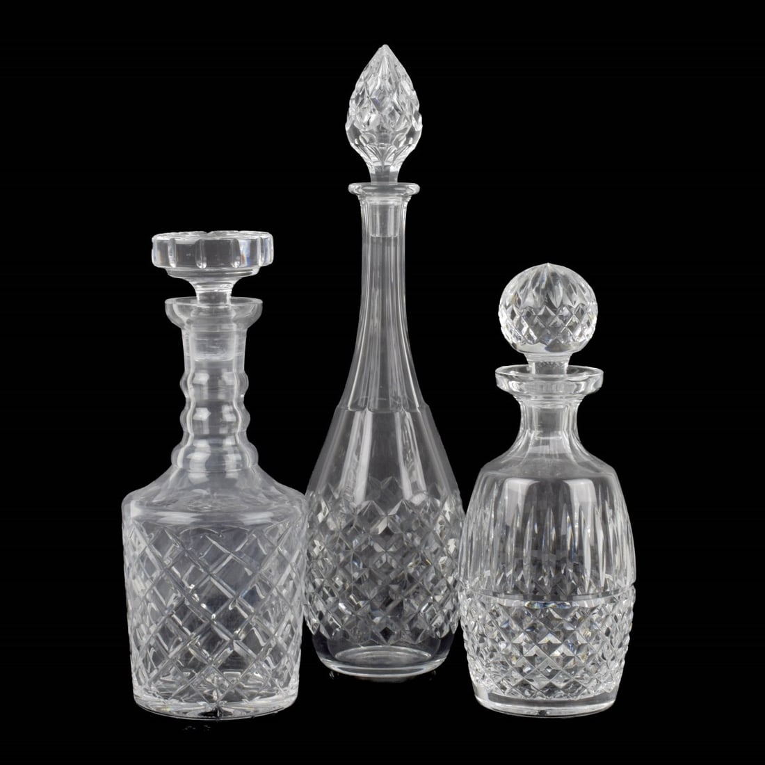 Three (3) Vintage Cut Crystal Decanters: Three (3) Vintage Cut Crystal Decanters. Consisting of one (1) Bacarrat "Burgos" signed decanter, measures: 15-3/4" high, one (1) Waterford "Lismore" signed decanter, measures: 10-1/2" high, one (1) u