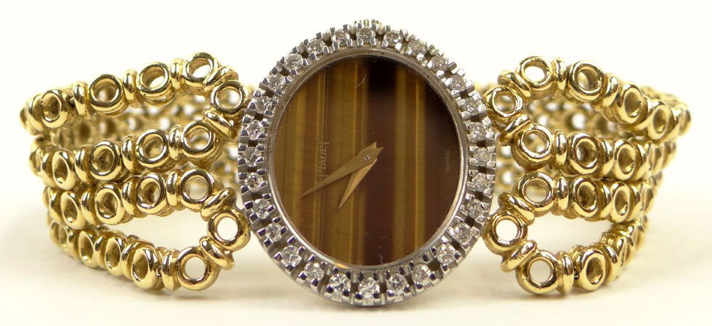 Lady's Vintage 18 Karat Yellow Gold and Diamond Piaget: Lady's Vintage 18 Karat Yellow Gold and Diamond Piaget Watch with Tiger Eye Face. Signed Piaget and Numbered. No Confirmation of Running Condition Otherwise Good Condition. Measures 7-1/8 Inches Long