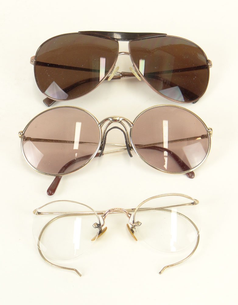 Three (3) Pair of Vintage Glasses Including: Man's: Three (3) Pair of Vintage Glasses Including: Man's Porsche Design Carrera Sunglasses; Man's Giorgio Armani Aviator style Sunglasses and a Pair of Rimless Gold Metal Glasses. Used Condition. Shipping $
