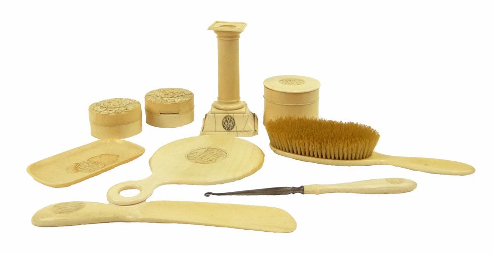 Seven (7) Piece and Two (2) Associated Pieces of: Seven (7) Piece and Two (2) Associated Pieces of Victorian Carved Ivory Vanity Set with Intricate Monogram. Pieces Include: Brush Measuring 8-3/4 Inches Long, Hand Mirror with Beveled Glass Measuring