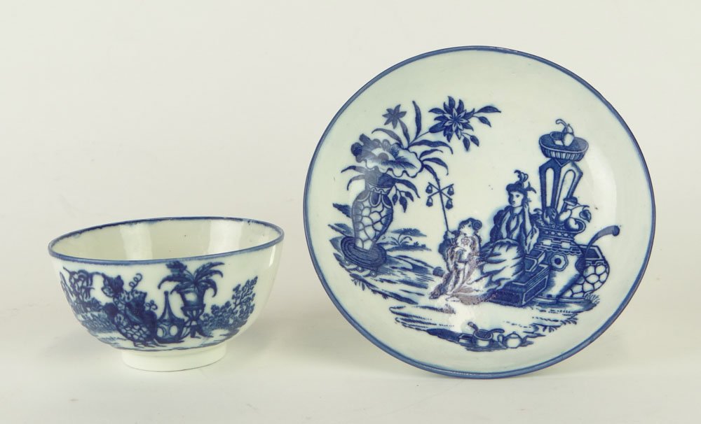 18th Century English Blue and White Porcelain Tea Cup: 18th Century English Blue and White Porcelain Tea Cup and Under Plate in the Chinese Style. Signed Under Glaze Blue "S" on Each Piece. Rubbing or else Good to Very Good Condition. Cup Measures 2 Inche