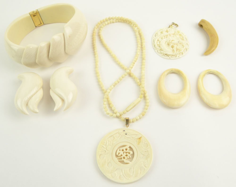 Collection of Seven (7) Items of Vintage Carved Ivory: Collection of Seven (7) Items of Vintage Carved Ivory Jewelry Including: A Bead Necklace with Chinese Carved Pendant; Chinese Carved Dragon Pendant; Tooth-like Pendant; Pair of Earrings; Two (2) Rings