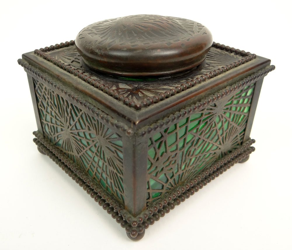 Early 20th Century Tiffany Studios New York Bronze and: Early 20th Century Tiffany Studios New York Bronze and Glass Inkwell in the "Pine Needle" Pattern. Signed and Numbered (partially rubbed out). Damage to Glass Insert and Rubbing Otherwise Good Conditi