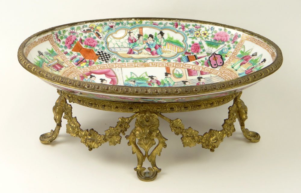 19th Century Chinese Export Porcelain Famille Rose: 19th Century Chinese Export Porcelain Famille Rose Medallion Oval Centerpiece with Bronze Ormolu Mounts. Polychrome Enamel Decoration with Panels of Court Figures, Birds and Flowers. Unsigned. Grout L