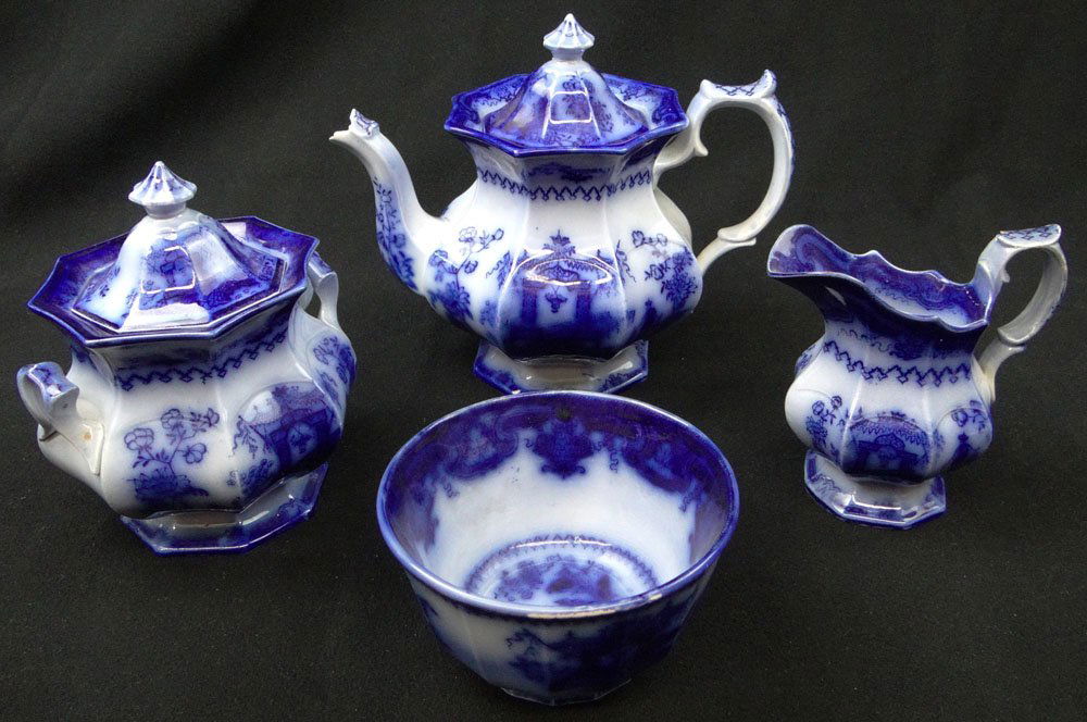 Circa 1845 T.J.& J. Mayer Four (4) Piece Flow Blue: Circa 1845 T.J.& J. Mayer Four (4) Piece Flow Blue Chinese Porcelaine Tea Set in the "Oregon" Pattern. Teapot, Covered Sugar & Creamer and Waste Bowl. Teapot has Chips to the Spout Otherwise in Good C
