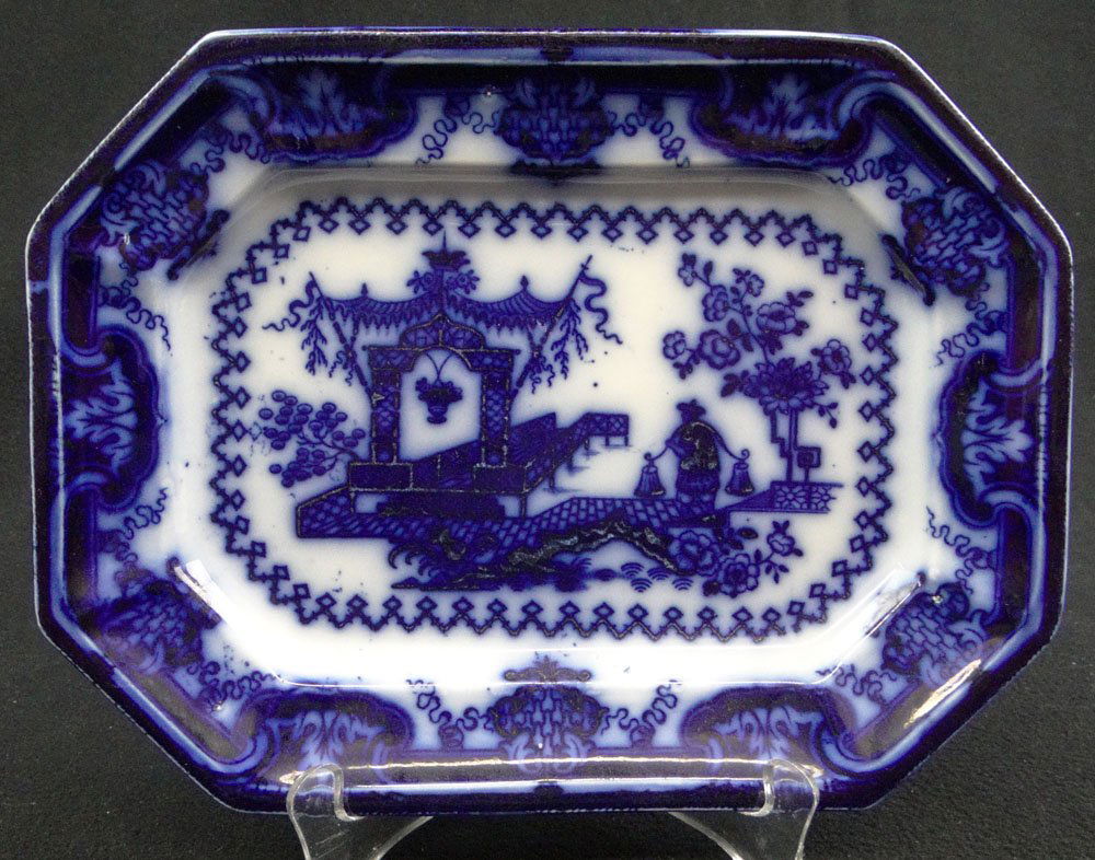 Circa 1845 Small Flow Blue Platter in the "Oregon": Circa 1845 Small Flow Blue Platter in the "Oregon" Pattern. Unsigned. Very Good Condition. Measures 10-1/2 Inches Long by 8 Inches Wide. Shipping $38.00