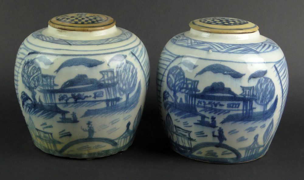 Pair of 19th Century Chinese Blue and White Porcelain: Pair of 19th Century Chinese Blue and White Porcelain Covered Ginger Jars. Unsigned. Rubbing and Small Chips to Bases, Covers are Discolored Otherwise in Good Condition. Each Measures 7-3/4 Inches Tal