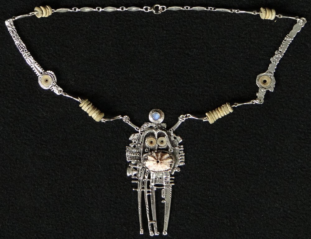 Unusual Abstract Design Silver Pendent. Abstract Design: Unusual Abstract Design Silver Pendent. Abstract Design of a Human Figure, Set with a Etched Semi Precious Stone Face and a Sea Shell at Mid Section. Signed. Signed Betsy Stoinhoff. Very Good Conditio