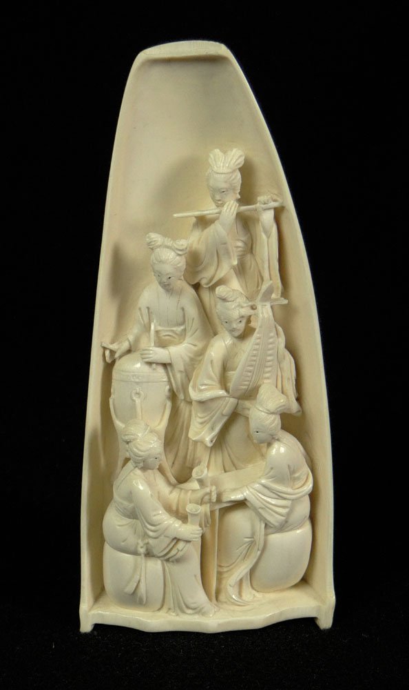 Antique Chinese Carved Ivory Wrist Rest Depicting: Antique Chinese Carved Ivory Wrist Rest Depicting Chinese Female Musical Group. Unsigned. Very Good Condition or Better. Measures 7-1/8 Inches Tall and 3-1/8 Inches Wide at the Base. This item will on