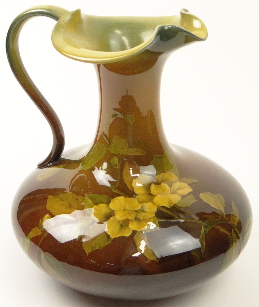 Matthew A. Daly, American (1860-1937) for Rookwood: Matthew A. Daly, American (1860-1937) for Rookwood Pottery Circa 1890 Glazed Earthenware Ewer. Incised Mark (logo), Date Mark and Artist Signature. Restoration to Handle at Rim Otherwise Good Conditio