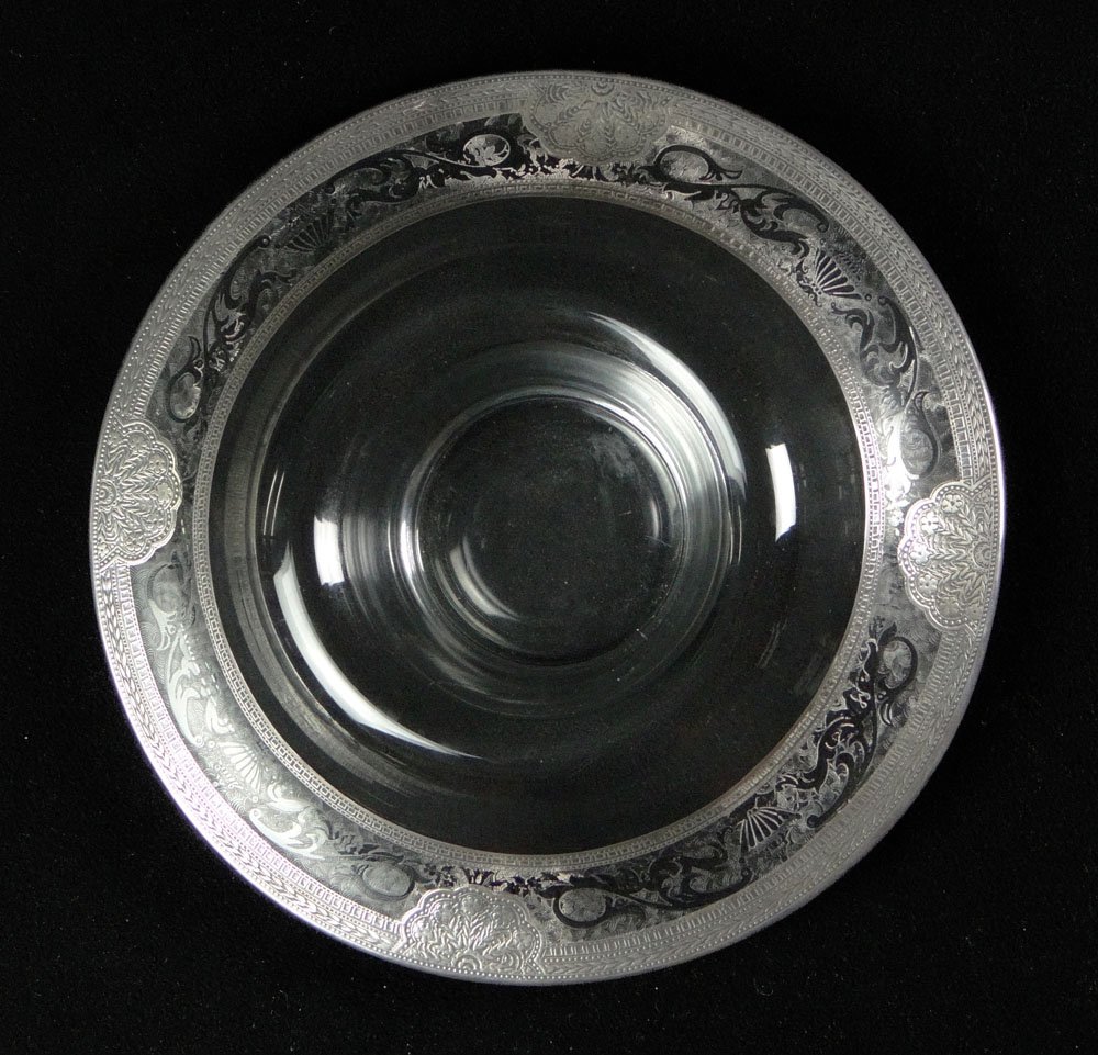 Early 20th Century Etched Glass Centerpiece with: Early 20th Century Etched Glass Centerpiece with Engraved Silver Overlay. Unsigned. Good Condition or Better. Measures Approximately 3 Inches Tall and 13 Inches Diameter. Shipping $46.00