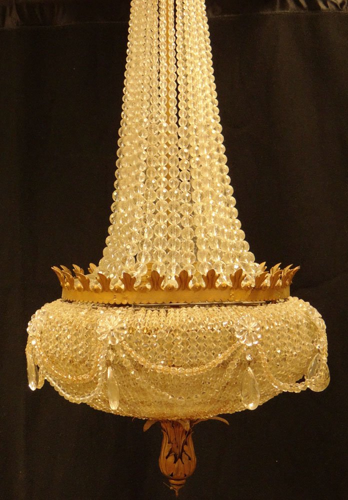 Mid 20th Century Cut Crystal Glass and Ormolu: Mid 20th Century Cut Crystal Glass and Ormolu Chandelier with Multiple Cut Glass Prism Swags. Very Good Condition. Measures 48 Inches Tall by 21 Inches Wide. We will not ship this item because in our