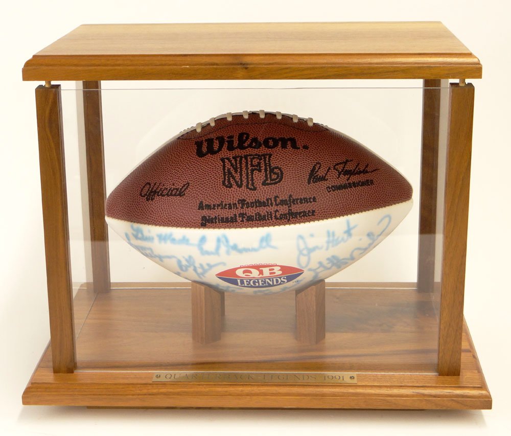 1991 Quarterback Legends Football. Several Signatures.: 1991 Quarterback Legends Football. Several Signatures. Very Good Condition. Nicely Mounted in a Wood and Plexiglass Display Case. Plaque Reads "Quarterback Legends 1991". Shipping $85.00