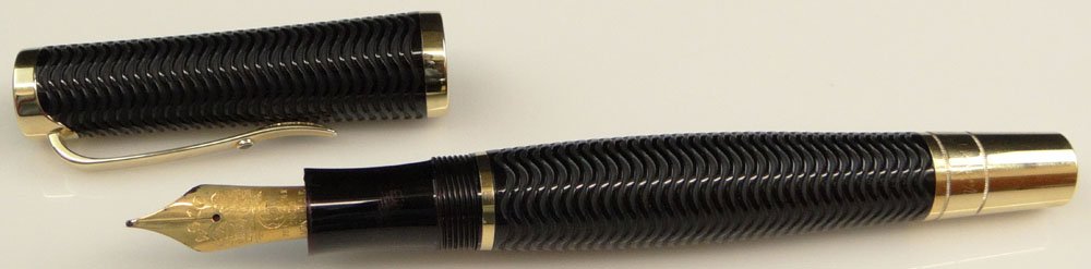 German Montblanc Meisterstuck Limited Edition "Virginia: German Montblanc Meisterstuck Limited Edition "Virginia Woolf" Writers Series Ribbed Black Resin Fountain Pen Accented with Ruby Inlay and 18 Karat Yellow Gold Nib. Signed and Numbered 09296/16,000. N