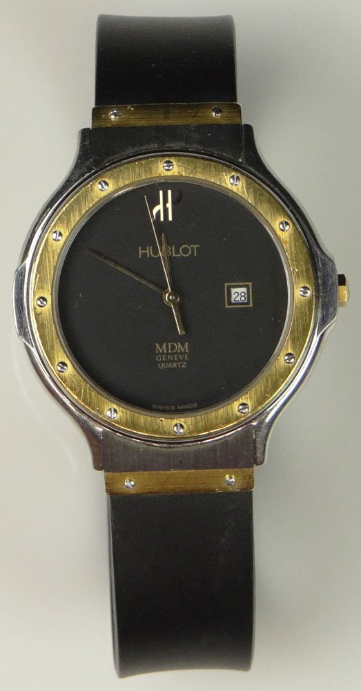 Man's Vintage Hublot MDM Geneve Stainless Steel and 18K: Man's Vintage Hublot MDM Geneve Stainless Steel and 18K Gold Wristwatch, Quartz Movement, with Rubber Bracelet and Mineral Crystal. Serial Number 67349. Surface Wear from Normal Use, Wear to Rubber Br