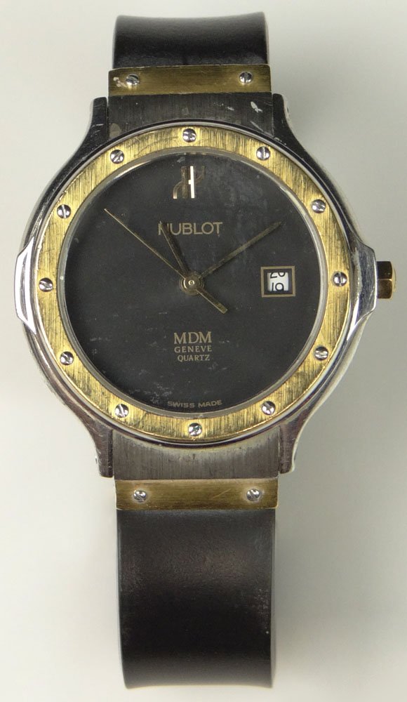 Lady's Vintage Hublot MDM Geneve Stainless Steel and: Lady's Vintage Hublot MDM Geneve Stainless Steel and 18K Gold Wristwatch, Quartz Movement, with Rubber Bracelet and Mineral Crystal. Serial Number 25071. Surface Wear from Normal Use, Need to Replace 