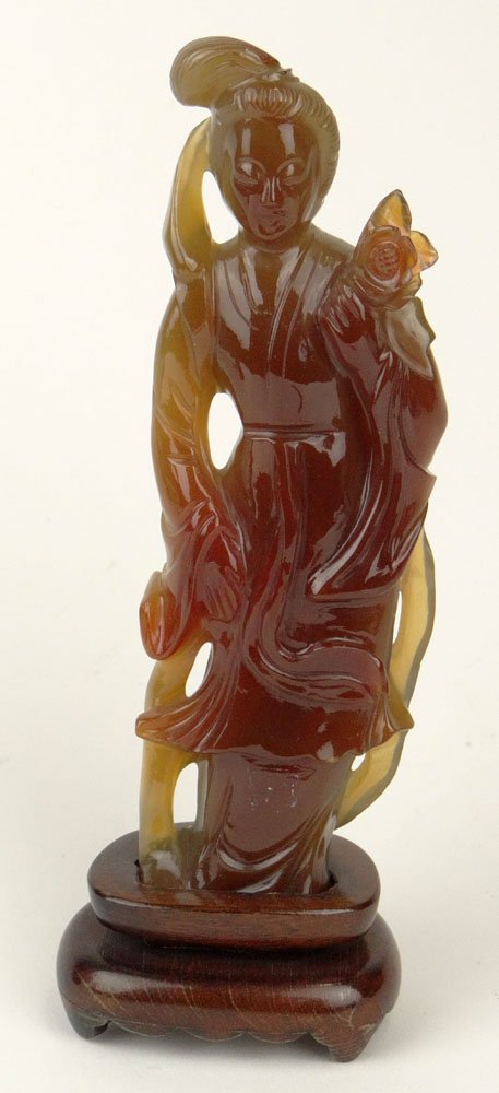 Chinese Carved Carnelian Guanyin with Carved Wood Base.: Chinese Carved Carnelian Guanyin with Carved Wood Base. Unsigned. Good Condition or Better. Measures 6-1/8 Inches Tall and 2-1/8 Inches Wide. Shipping $34.00