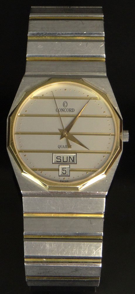 Man's Concord Mariner SG 18 Karat Yellow Gold and: Man's Concord Mariner SG 18 Karat Yellow Gold and Stainless Steel Quartz Watch. Signed. Surface Wear Consistent with Normal Use. Not Running (likely needs a new battery), Otherwise Good Condition. Cas