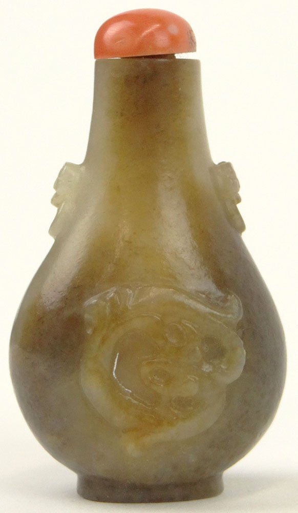 19th Century Chinese Carved Jade Snuff Bottle with Mock: 19th Century Chinese Carved Jade Snuff Bottle with Mock Ring Handles and Coral Stopper. Good to Very Good Condition. From the Collection of a Founding Member of the International Chinese Snuff Bottle
