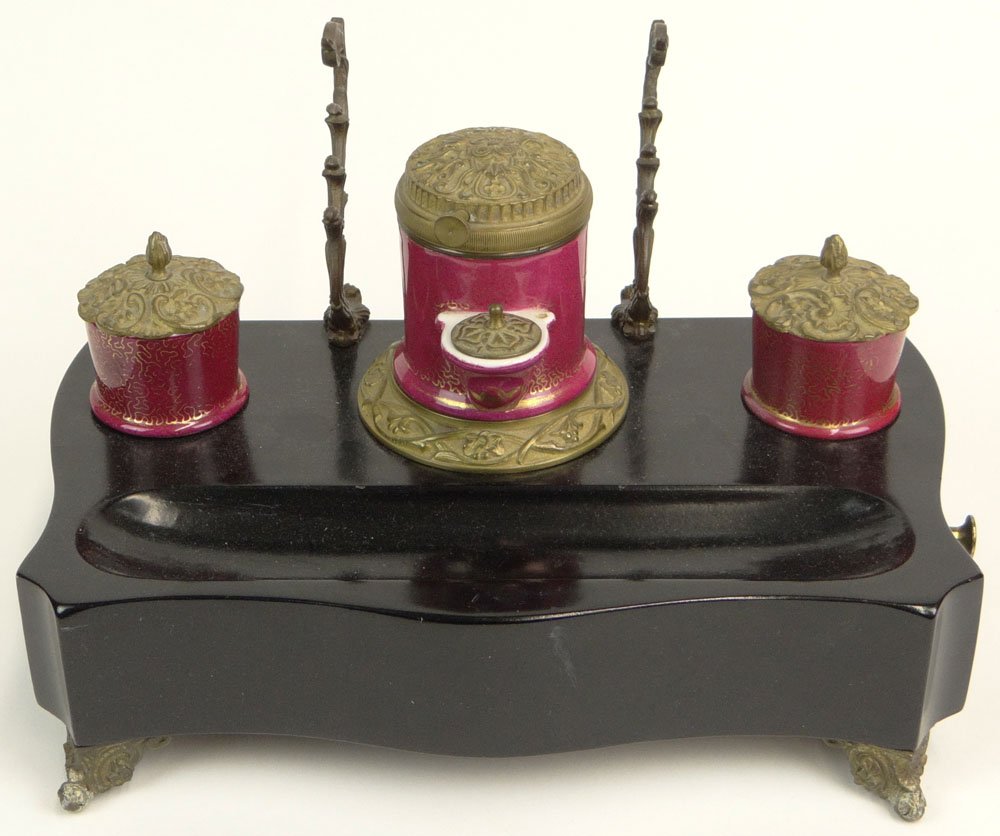19/20th Century Continental Ebonized Wood, Porcelain: 19/20th Century Continental Ebonized Wood, Porcelain and Bronze Mounted Inkstand with Hidden Drawer. Unsigned. Good Condition. Measures 7 Inches Tall, 11-5/8 Inches Wide and about 7-1/4 Inches Depth. 