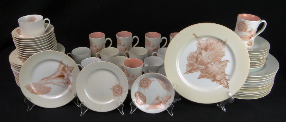 Fifty Nine (59) Piece Fitz and Floyd Porcelain Dinner: Fifty Nine (59) Piece Fitz and Floyd Porcelain Dinner Service in the "Coquille" Pattern. Under Glaze Black Back Stamp Signed Coquille, Fitz & Floyd, Japan. Service Includes: 11 Dinner Plates Measuring