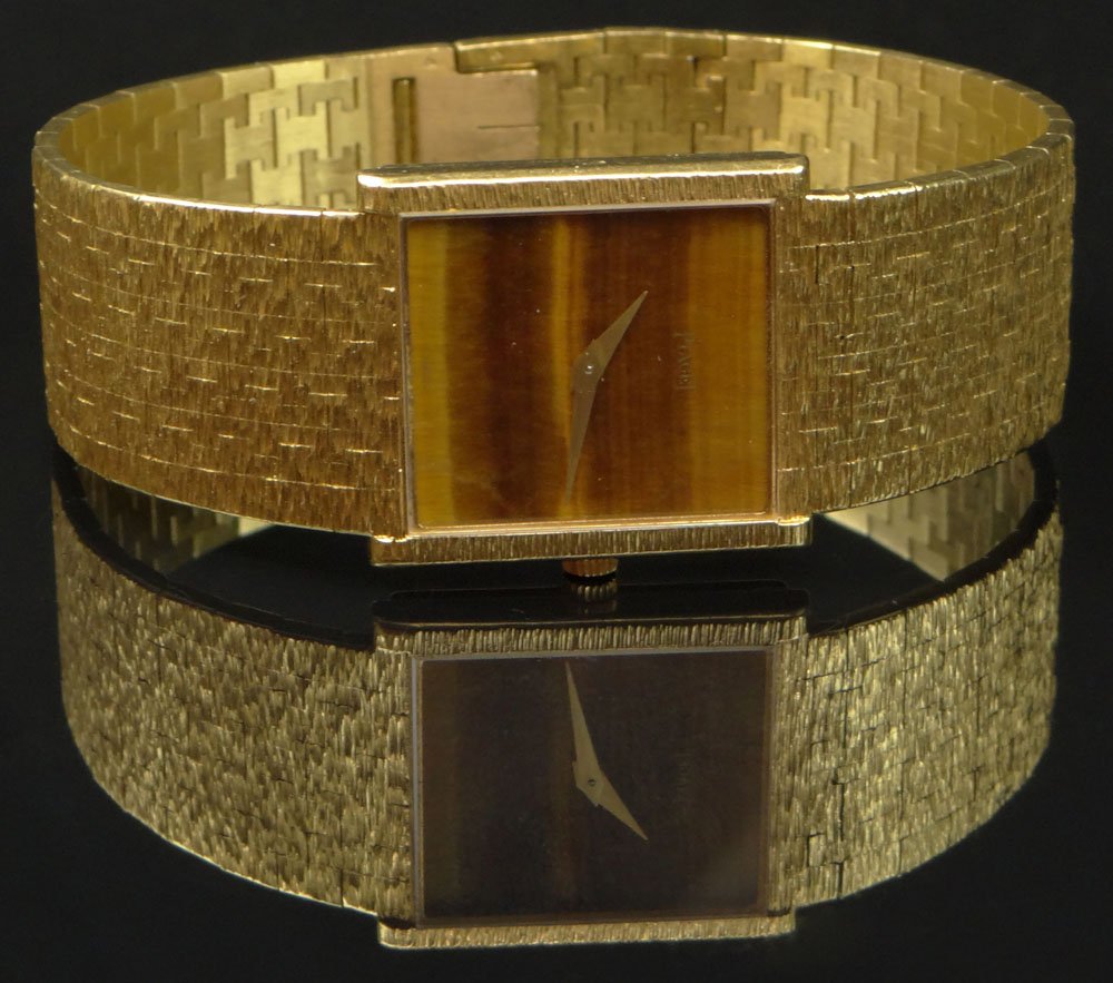 Man's Vintage Piaget 18 Karat Yellow Gold Bracelet: Man's Vintage Piaget 18 Karat Yellow Gold Bracelet Watch with Tiger Eye Dial. Signed. Minor Surface Wear from Normal Use Otherwise Good Condition. Case Measures 1 Inch Tall and 7/8 Inch Wide, Bracelet