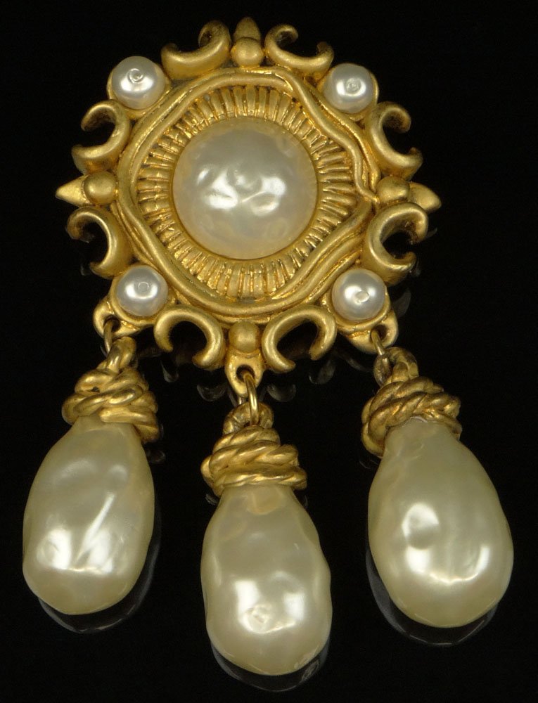 Large Retro Chanel Faux Pearl Gold Tone Brooch. Pin: Large Retro Chanel Faux Pearl Gold Tone Brooch. Pin Back with Locking Clasp. Original Box. Signed on Back Chanel, Made In France, 2, CC Logo, 6. Very Good Condition. Measures 2-1/4 Inches Diameter, 4