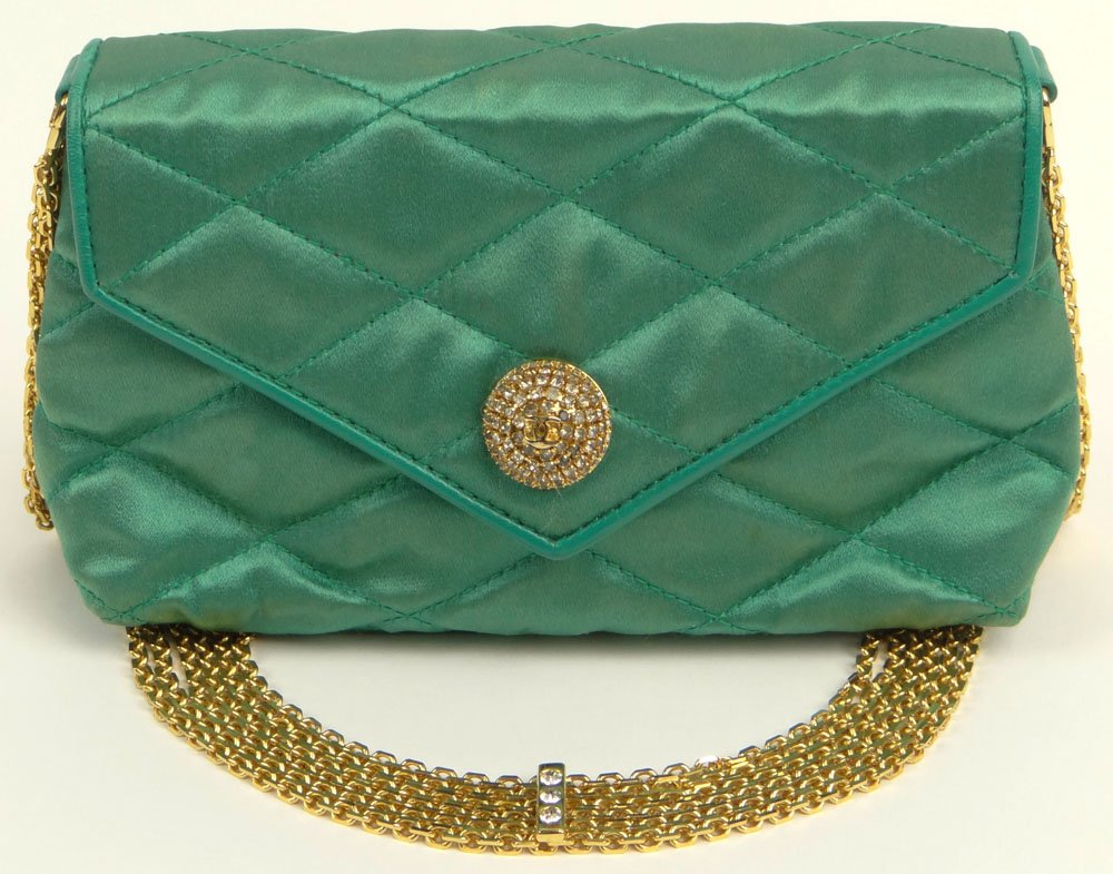 Retro Chanel Quilted Green Satin Evening Bag with: Retro Chanel Quilted Green Satin Evening Bag with Jeweled Snap Closure. Multi Chains and Jeweled Gold Tone Shoulder chain. Original Dust Bag. Embossed Signature inside, Double C on Snap Closure. Leath