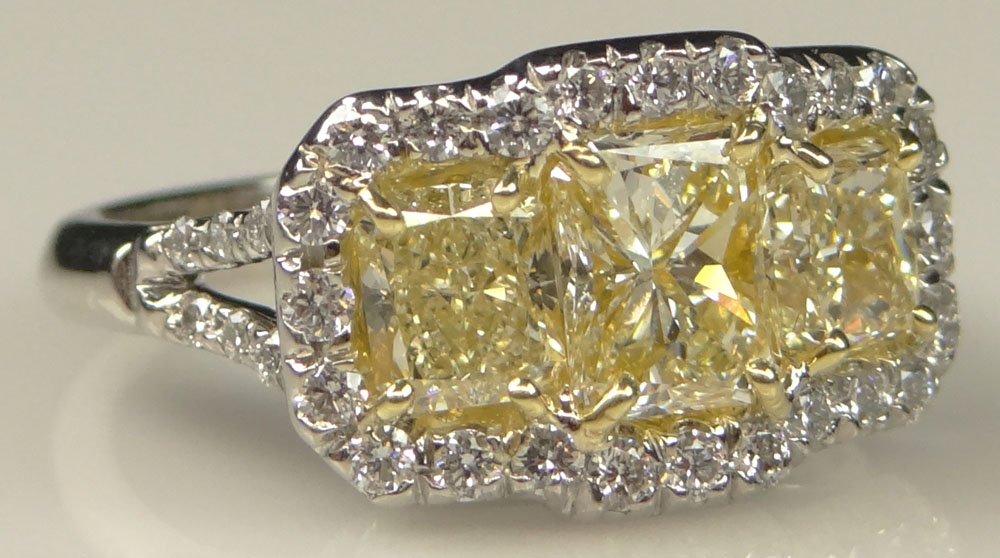 Lady's Gem Quality 2.40 Carat Total Weight Three: Lady's Gem Quality 2.40 Carat Total Weight Three Radiant Cut Fancy Intense Yellow Diamond, .65 Carat Round Brilliant Cut Diamond, Platinum and 18 Karat Yellow Gold Ring. Yellow Diamonds VS1-VS2 Clarit