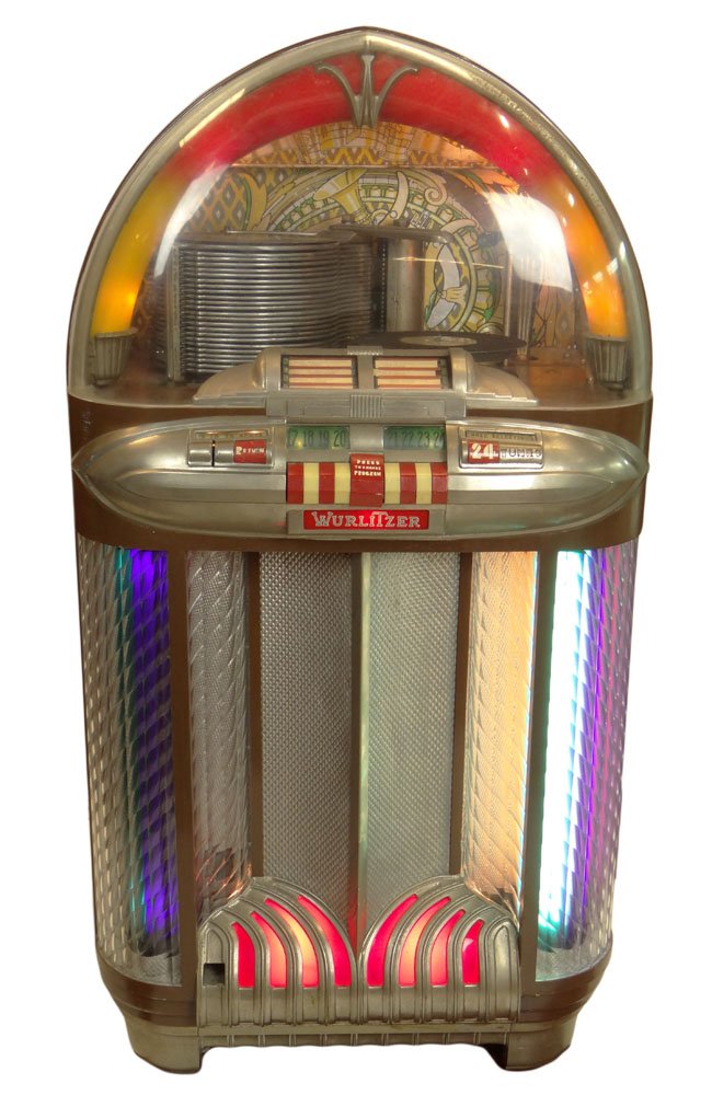 Vintage 1940-50's Wurlitzer 1100 Jukebox. Walnut and: Vintage 1940-50's Wurlitzer 1100 Jukebox. Walnut and Man-Made Case. The 1100 is a 24 selection jukebox that plays 78-RPM records. Records Included. It was reported to the Gallery that a spring needs t