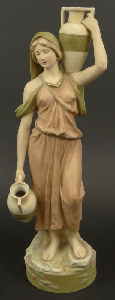 Royal Dux Porcelain Figure "The Water Carrier" Signed.: Royal Dux Porcelain Figure "The Water Carrier" Signed. Drilled for a Lamp or in Otherwise Good Condition. Measures 18-1/4 Inches Tall and 5 Inches Wide. Domestic Shipping $95.00