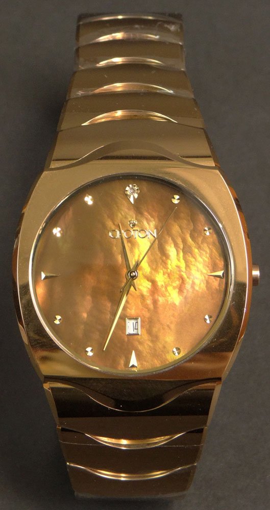 New in Box Man's Croton Swiss Movement Quartz Watch: New in Box Man's Croton Swiss Movement Quartz Watch with Mother of Pearl Dial, Tungsten Bezel and Bracelet and Sapphire Crystal Model J175386-2. New and Unused in Original Box with Paper Work. Needs B
