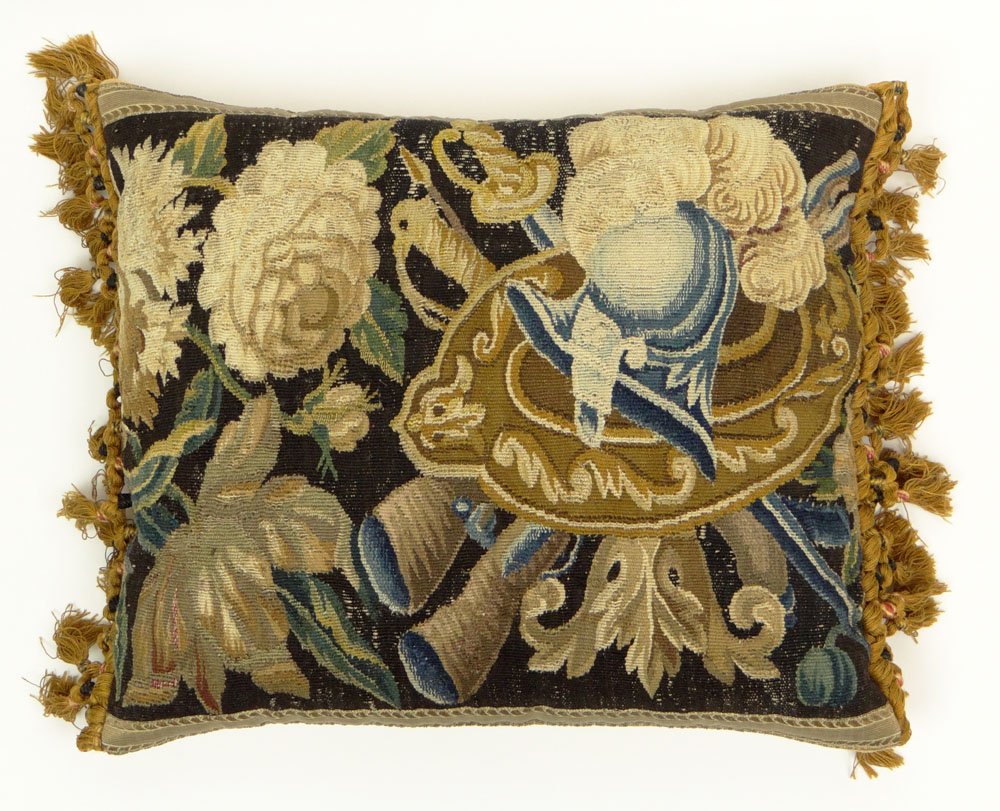 18th Century Continental Tapestry-Faced Aubusson: 18th Century Continental Tapestry-Faced Aubusson Pillow. Navy Ground with a Shield, Helmet, Sword and Floral Motif in Blue, Brown, Beige, White and Gold, Trimmed with Gold Fringe and Tassels. Surface 