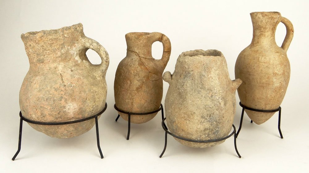 Lot of 4 Archaic Middle Eastern Pottery Containers.: Lot of 4 Archaic Middle Eastern Pottery Containers. Various Sizes, Various Conditions, all with signed of age. Unsigned. Measures 7 Inches, 6 Inches, 5 Inches, 4 Inches Respectively. Shipping $98.00