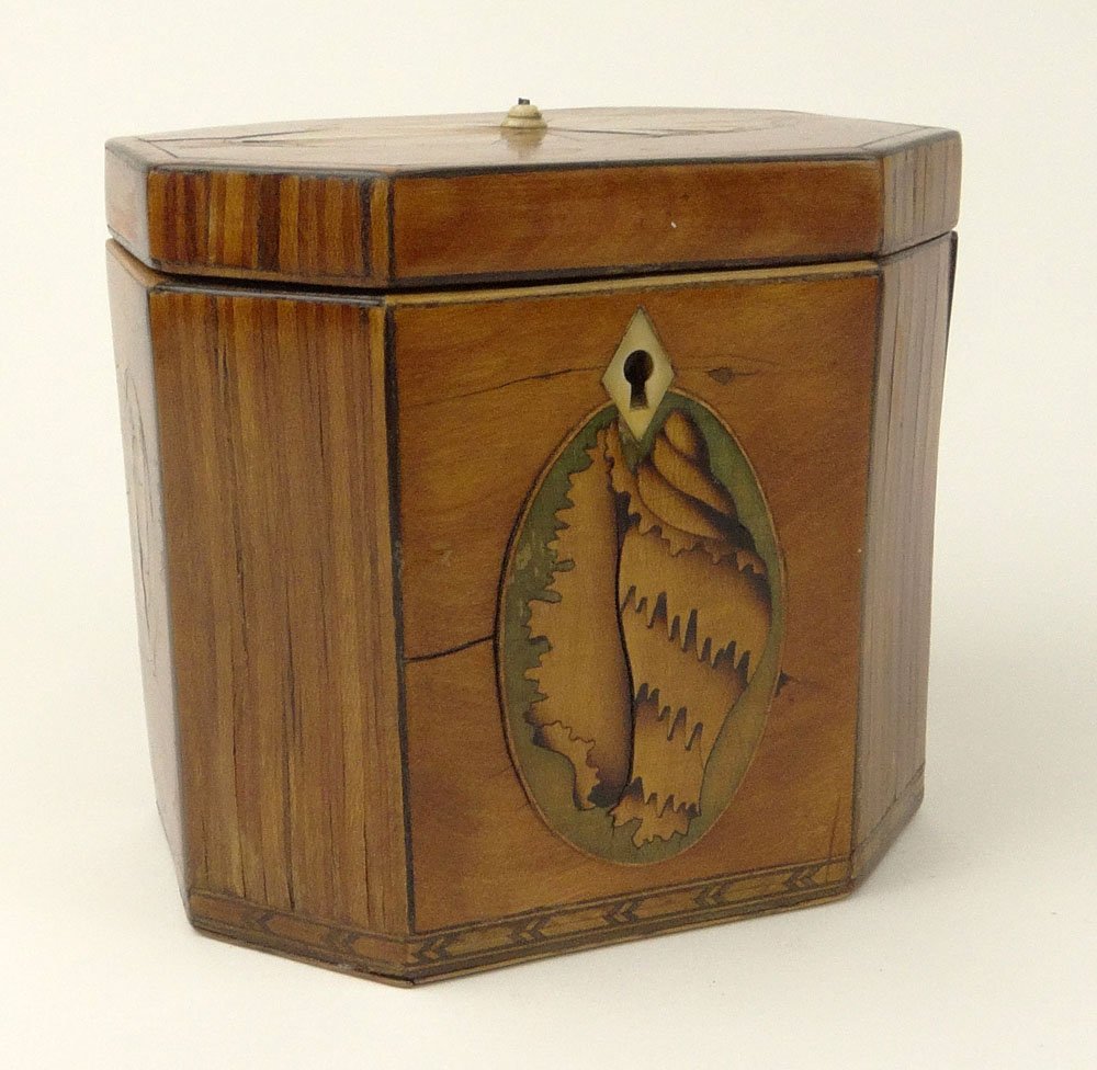 19th C English Inlaid Wood Tea Caddy. Fine Conch Shell: 19th C English Inlaid Wood Tea Caddy. Fine Conch Shell Motif. Zinc/Lead lined. Unsigned. Finial Pull is Damaged. Veneer is Lifting, or in Otherwise Good Condition. Measures 4-5/8 Inches Tall, 5 Inches