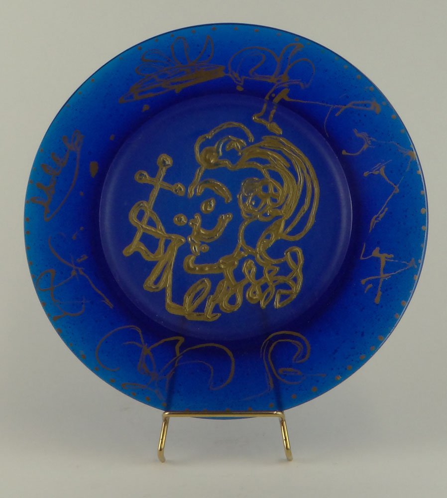 Salvador DalÃ­, Spanish )1904-1989) for Daum Pate de: Salvador DalÃ­, Spanish )1904-1989) for Daum Pate de Verre Plate "La Triomphale". Etched Signature and Numbered 1938/2000 en verso. Good Condition or Better. Measures 10-3/8 Inches Diameter. Shippin