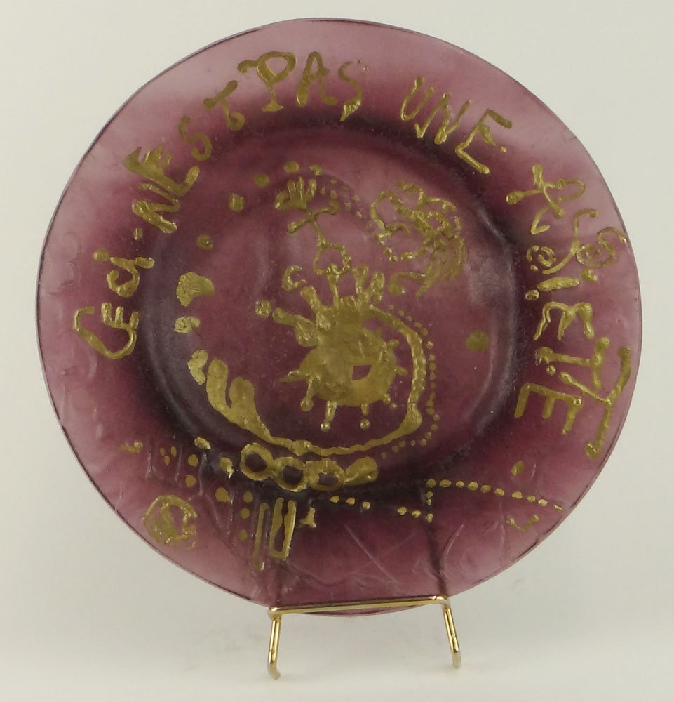 Salvador DalÃ­, Spanish )1904-1989) for Daum Pate de: Salvador DalÃ­, Spanish )1904-1989) for Daum Pate de Verre Plate "Ceci n'est pas un assiete". Etched Signature and Numbered 1188/2000 en verso. Good Condition or Better. Measures 10-3/8 Inches Diame