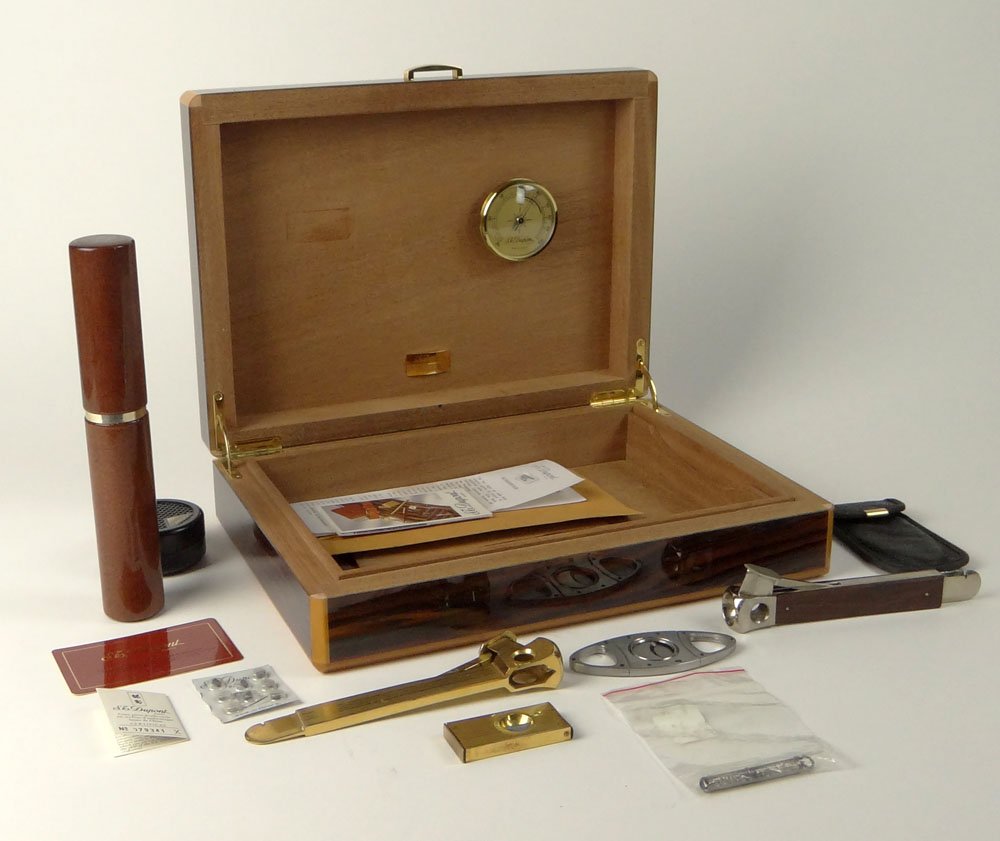 S.T. Dupont Macassar Humidor with Various Size Cigar: S.T. Dupont Macassar Humidor with Various Size Cigar Cutters and Tiffany & Company Sterling Silver, Cigar Puncher. Humidity Gage Mounted to Interior. Signed S.T. Dupont Paris. Very Good Condition (Lik