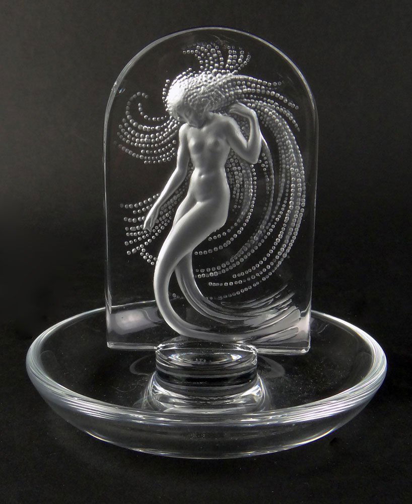 Lalique French Art Glass "Naide" Mermaid Panel Ring: Lalique French Art Glass "Naide" Mermaid Panel Ring Holder. Stamped to Base Lalique France. Minor Flea Bite to Panel, Otherwise Good Condition. Measures 4 Inches Tall by 4 Inches Wide. Shipping $32.00