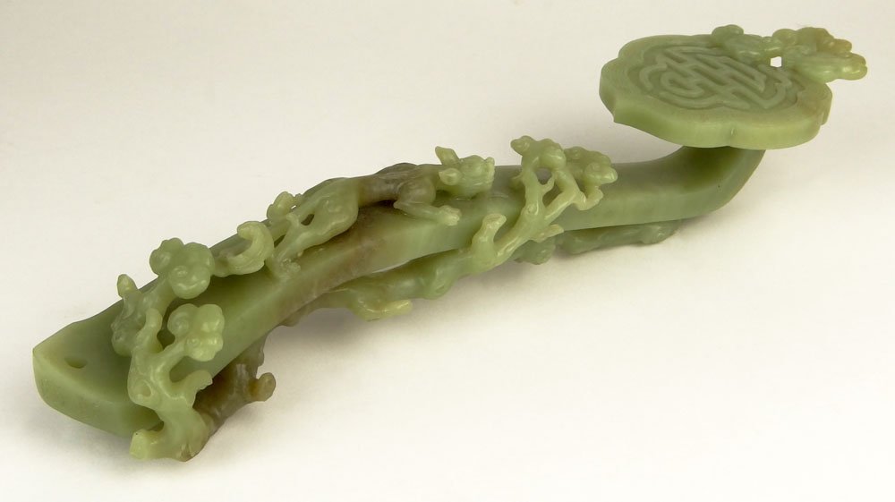 Chinese Carved Celadon Jade Ruyi Scepter. Qianlong Four: Chinese Carved Celadon Jade Ruyi Scepter. Qianlong Four Character Mark. Good Condition or Better. Measures 12 Inches Long and 3-1/8 Inches Wide. Shipping $48.00