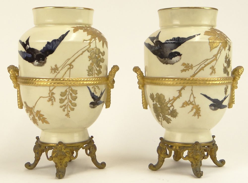 Pair of 19/20th Century English Royal Worcester style: Pair of 19/20th Century English Royal Worcester style Gilt Bronze Mounted Porcelain Urns with Bird and Relief Rope Decoration. Unsigned. Good Condition or Better. Measure 9-1/2 Inches Tall and 6-3/8 I